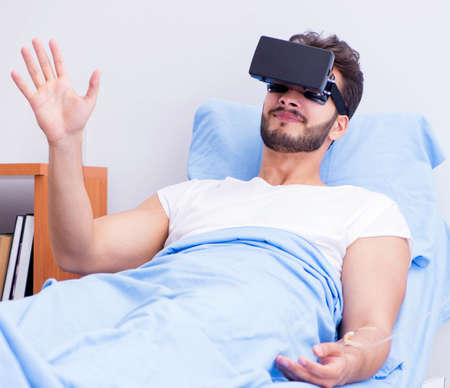 Patient in the hospital with VR glasses headset