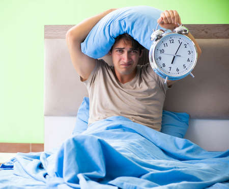 Man having trouble with his sleepの写真素材