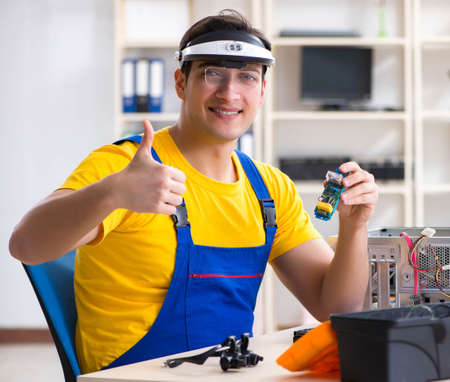 Computer repair technician repairing hardware