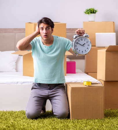Young man moving to new apartment