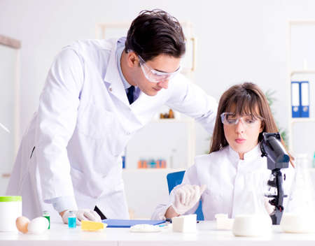 Two lab doctor testing food productsの写真素材