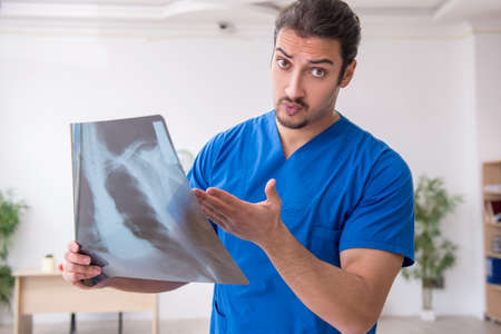 Young male doctor working in the clinic
