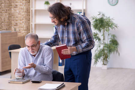 Two employees in retirement conceptの写真素材