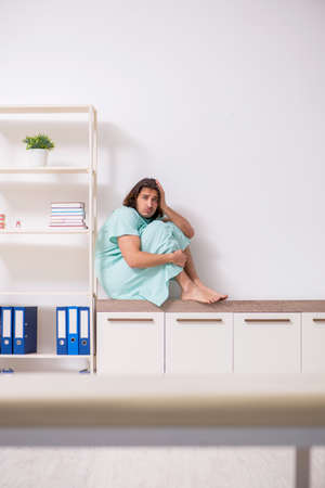 Young mad man in the hospitalの写真素材