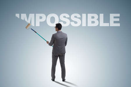 Businessman in impossible business conceptの写真素材