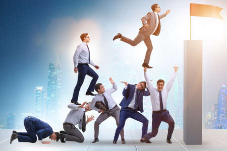 Career progression concept with businessman climbing stairsの写真素材