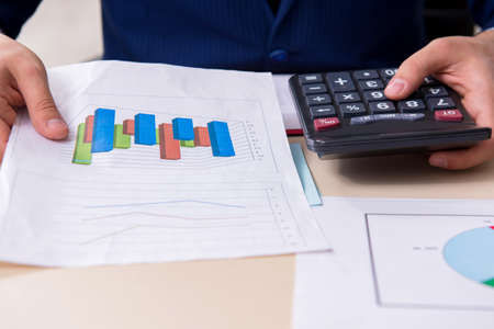 Young male financial manager in the office
