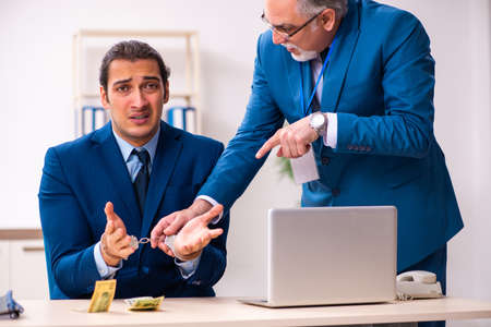 Male employee and cop in police investigation concept