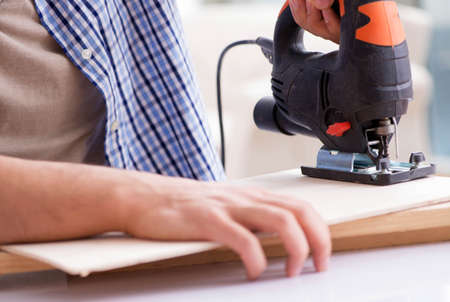 Young man in woodworking hobby concept