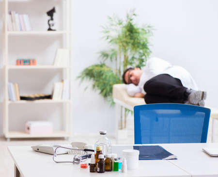 Doctor relaxing after complex surgery in hospitalの写真素材