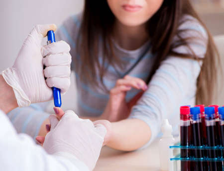 Patient during blood test sampling procedure taken for analysisの写真素材