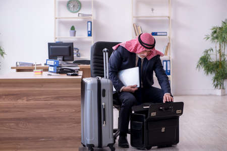 Old arab businessman preparing for business tripの写真素材