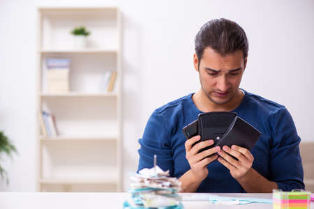 Young man in budget planning concept