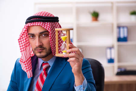 Young male arab employee working in officeの写真素材