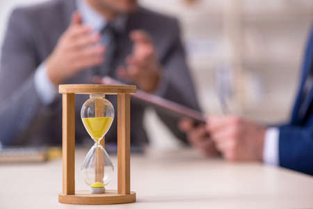 Two businessmen in time management concept