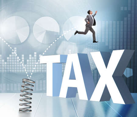 Businessman jumping from spring in business conceptの写真素材