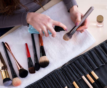 Make-up artist preparing brushes for work