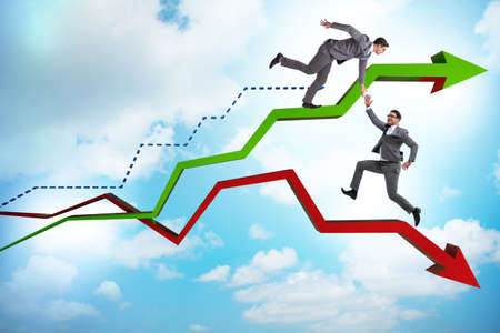 Businessman saving competitor during the crisisの写真素材