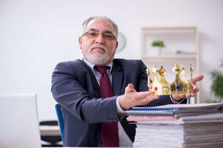 Old king businessman employee at workplaceの写真素材