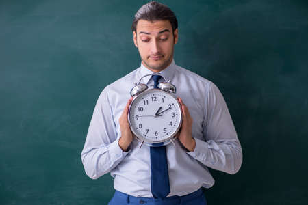 Young man employee in business presentation concept