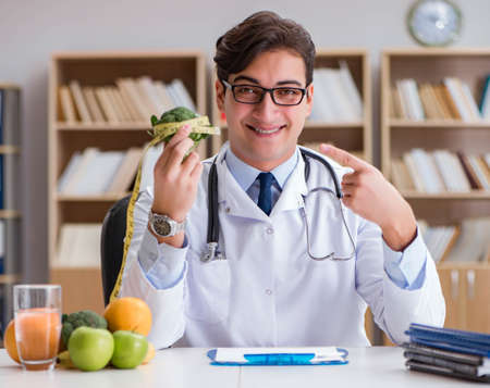 The scientist studying nutrition in various foodの写真素材