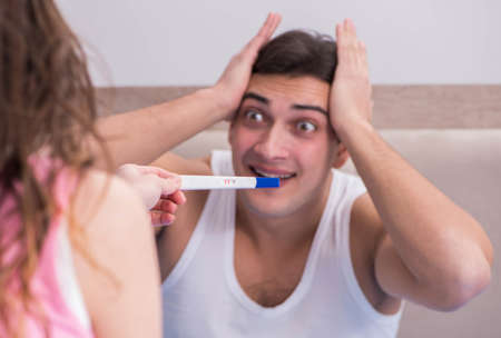 The young family with pregnancy test resultsの写真素材