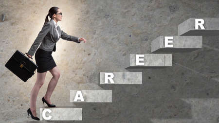 The businesswoman climbing career ladder in business concept