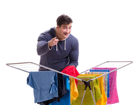 The husband man doing laundry isolated on whiteの写真素材