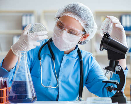 The female scientist researcher doing experiments in laboratory