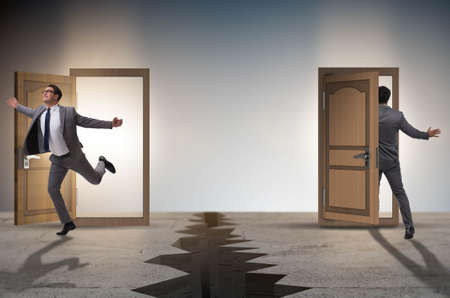 Businessman in teleportation concept with doorsの写真素材