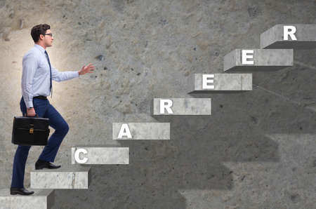 The businessman climbing career ladder in business conceptの写真素材