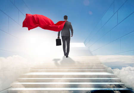 Businessman superhero successful in career ladder concept
