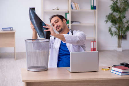 Young male doctor working in the clinicの写真素材