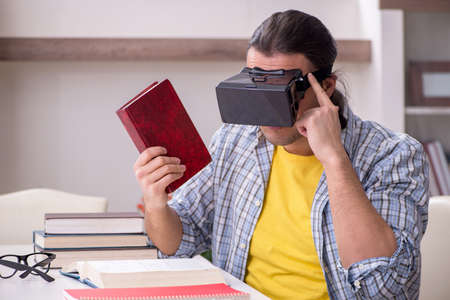 Young male student preparing for exam at homeの写真素材