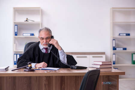 Old male judge working in the courthouseの写真素材