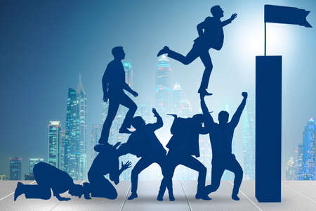 Career progression concept with businessman climbing stairsの写真素材