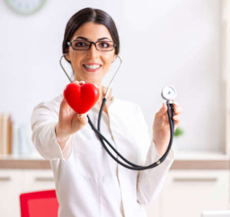 Young doctor in heart care conceptの写真素材