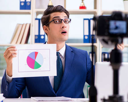 Businessman recording a video for vlog