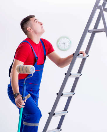 Male painter preparing for painting job at construction siteの写真素材