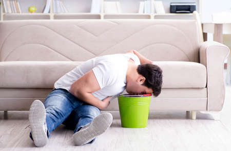 Man suffering from sick stomach and vomitingの写真素材
