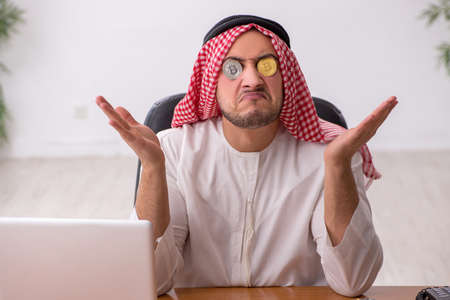 Young male arab employee working in the officeの写真素材