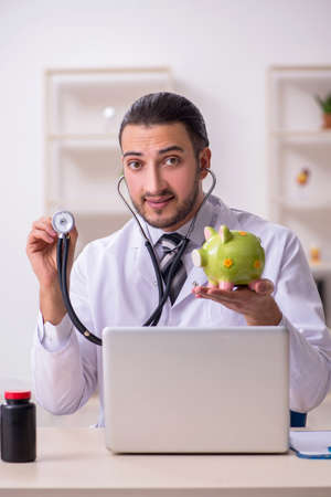 Young male doctor working in the clinicの写真素材
