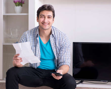 Man trying to fix broken tv