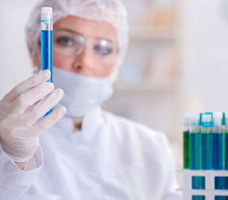 Woman chemist working in hospital clinic lab