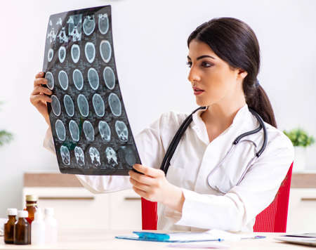 Female doctor radiologist with x-ray can image