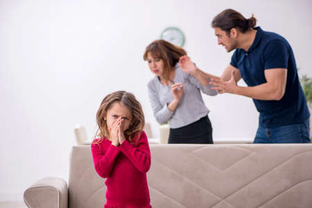 Young couple and their daughter in family conflict conceptの写真素材