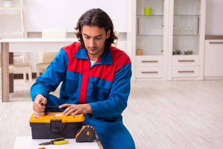 Young male carpenter working indoorsの写真素材