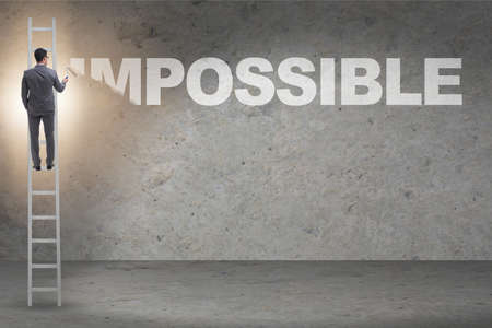 Businessman in impossible business conceptの写真素材