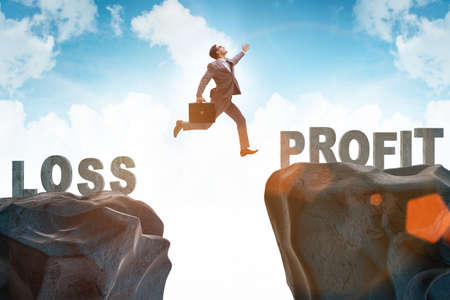Concept of going from loss to profit with businessmanの写真素材