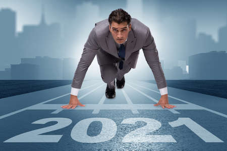 Businessman on finish line to year 2021の写真素材